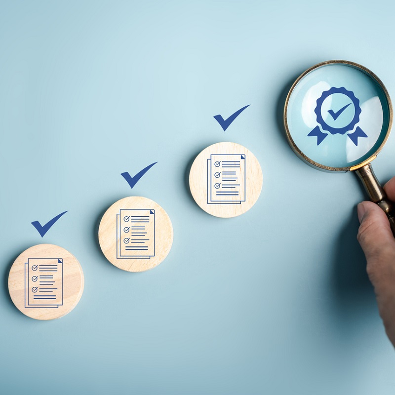 Certificate approval process with document checklist, magnifying focus quality assurance, verification system, compliance audit, and standard validation. for ISO